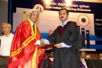 Director hands over the first Ph.D. degree