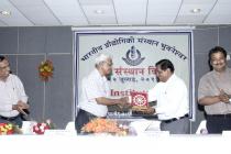 Director Professor M Chakraborty presenting a memento to the Chief Guest Prof SG Dhande on 6th  Institute Day Function. Dy Director Prof G Panda and Registrar B K Ray look on